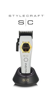 StyleCraft Instinct Metal Clipper SC611M with White Cover on Charging Stand with Logo